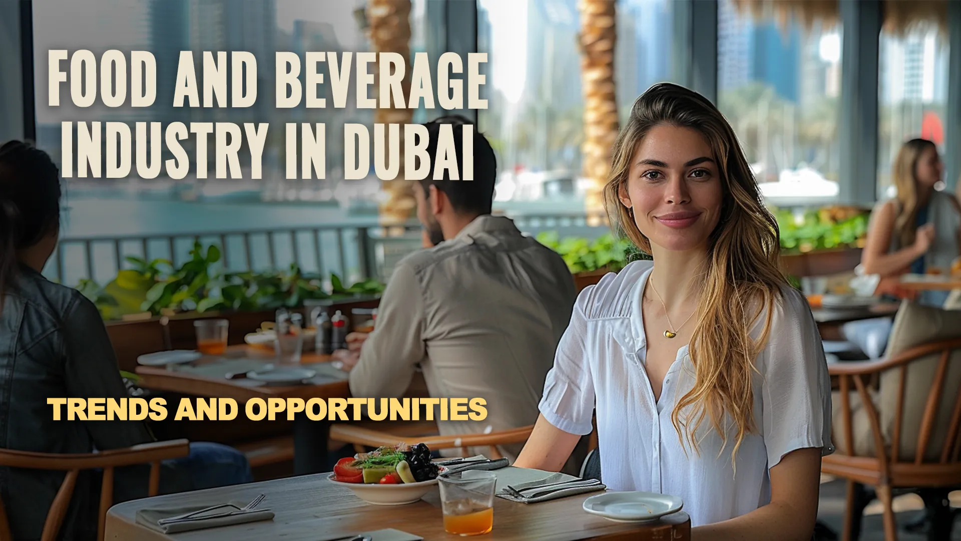 Woman dining at a restaurant on an outdoor terrace with a dish in front of her. Dubai cityscape and a water feature in the background